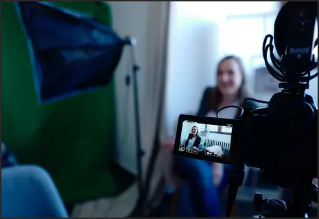 Behind the camera of a filmaker filming