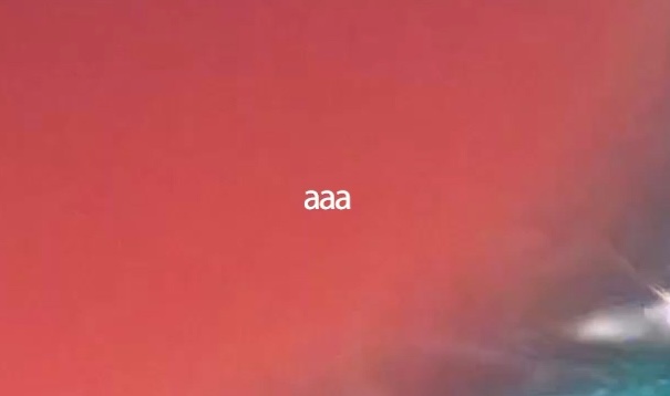 Blurry red and blue background with the white text aaa centered in the image.